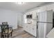 Modern kitchen with white cabinets, stainless steel appliances, and quartz countertops at 2395 19Th St, Sarasota, FL 34234