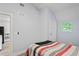 Bright bedroom with wood-look floors and window at 2395 19Th St, Sarasota, FL 34234