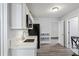 White kitchen with quartz countertops and gold fixtures at 2395 19Th St, Sarasota, FL 34234
