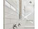Modern bathroom with tiled walls, shower head, and built-in bench at 1268 Kazaz Ct, Zephyrhills, FL 33540