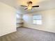Bright bedroom with carpet, built-in shelving, and window with blinds at 34051 Brown Byu, Wesley Chapel, FL 33543