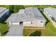 Single-story mobile home with carport and landscaping at 34051 Brown Byu, Wesley Chapel, FL 33543