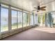 Spacious sunroom with large windows and ceiling fan at 34051 Brown Byu, Wesley Chapel, FL 33543