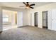 Large bedroom with carpet, double closets, and en-suite bathroom at 34051 Brown Byu, Wesley Chapel, FL 33543