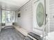 Front entry with a glass door and a small covered porch at 34051 Brown Byu, Wesley Chapel, FL 33543