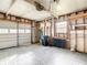 Unfinished garage with open garage door and storage at 34051 Brown Byu, Wesley Chapel, FL 33543