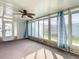 Sunroom features large windows, carpet, and curtains at 34051 Brown Byu, Wesley Chapel, FL 33543