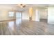 Bright living room with light gray vinyl plank flooring at 34051 Brown Byu, Wesley Chapel, FL 33543