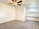 Spacious bedroom with ceiling fan and built-in shelving at 34051 Brown Byu, Wesley Chapel, FL 33543
