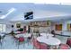 Community room with tables, chairs, fireplace, and TV at 34051 Brown Byu, Wesley Chapel, FL 33543