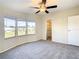 Bright bedroom with large windows, ample closet space, and neutral carpeting at 34051 Brown Byu, Wesley Chapel, FL 33543