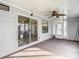 Sunroom with sliding glass doors and ceiling fan at 34051 Brown Byu, Wesley Chapel, FL 33543