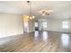 Spacious living room with light wood laminate flooring at 34051 Brown Byu, Wesley Chapel, FL 33543