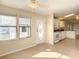 Open kitchen with white cabinets and stainless steel appliances at 34051 Brown Byu, Wesley Chapel, FL 33543