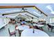 Large community room with tables, chairs, and a high ceiling at 34051 Brown Byu, Wesley Chapel, FL 33543
