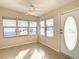 Bright sunroom with tiled floors and multiple windows at 34051 Brown Byu, Wesley Chapel, FL 33543