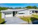 Single-wide manufactured home with attached garage at 34051 Brown Byu, Wesley Chapel, FL 33543