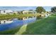 Community canal view with lush green landscaping at 34051 Brown Byu, Wesley Chapel, FL 33543