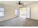 Bright bedroom with en-suite bathroom and carpet flooring at 34051 Brown Byu, Wesley Chapel, FL 33543