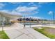 Community pool with surrounding fence and lounge chairs at 34051 Brown Byu, Wesley Chapel, FL 33543