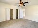 Spacious bedroom with double closets and neutral carpeting at 34051 Brown Byu, Wesley Chapel, FL 33543