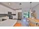 Modern kitchen with white cabinets and stainless steel appliances at 12971 Dream Catcher Way, Riverview, FL 33579