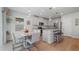 Kitchen dining area with granite table and modern chairs at 18212 Hunters Meadow Walk, Land O Lakes, FL 34638