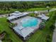 Aerial view of community pool with cabanas and playground at 18212 Hunters Meadow Walk, Land O Lakes, FL 34638