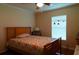 Bedroom with floral bedding, a nightstand, and window blinds at 20006 Nob Oak Ave, Tampa, FL 33647