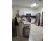 Modern kitchen with stainless steel appliances and granite countertops at 20006 Nob Oak Ave, Tampa, FL 33647