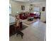 Spacious living room with sectional sofa and dining area view at 20006 Nob Oak Ave, Tampa, FL 33647