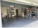 Spacious garage with plenty of storage shelving and a laundry area at 20006 Nob Oak Ave, Tampa, FL 33647