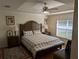 Main bedroom with wood flooring and a large bed at 20006 Nob Oak Ave, Tampa, FL 33647