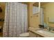 Small bathroom with shower, granite countertop, and anchor-themed curtain at 20006 Nob Oak Ave, Tampa, FL 33647