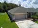 House exterior with attached garage at 20006 Nob Oak Ave, Tampa, FL 33647