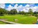 Golf course with a bench overlooking a pond at 37222 Cora Ave, Zephyrhills, FL 33542