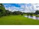Golf course with lush green fairways and a pond at 37222 Cora Ave, Zephyrhills, FL 33542