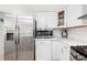 Modern kitchen with stainless steel appliances and white cabinets at 37222 Cora Ave, Zephyrhills, FL 33542