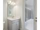 Bathroom featuring a modern vanity, bright lights, and a door with glass leading to an enclosed porch at 157 Hidden Estates Ct, Brandon, FL 33511