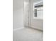 Clean bedroom has light colored carpet and a view of the neighborhood at 157 Hidden Estates Ct, Brandon, FL 33511