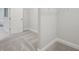 A walk-in closet offers ample storage space with custom shelving and carpeted floors at 157 Hidden Estates Ct, Brandon, FL 33511