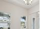 A home's entryway features lots of light, white walls, and a decorative chandelier at 157 Hidden Estates Ct, Brandon, FL 33511