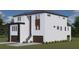 Modern two-story home with dark brown garage doors and a metal railing at 2221 S Occident St, Tampa, FL 33629