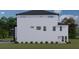 Rear view of a modern two-story home showcasing a clean design at 2221 S Occident St, Tampa, FL 33629