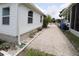 Side view of the home, showing the well maintained landscaping at 119 S Saint Thomas Cir, Apollo Beach, FL 33572