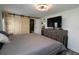 Main bedroom with king-size bed, dresser, and barn doors leading to bathroom at 119 S Saint Thomas Cir, Apollo Beach, FL 33572