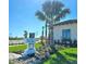 Community center at Vistara with well-manicured landscaping, modern architecture, and a welcoming sign at 652 Allora Ave, Nokomis, FL 34275