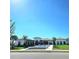 Stunning exterior view of a well-maintained residential community featuring lush landscaping, modern architecture and street view at 652 Allora Ave, Nokomis, FL 34275
