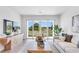 Inviting living room with sliding glass doors showcasing serene outdoor views and a modern entertainment center at 652 Allora Ave, Nokomis, FL 34275