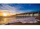 A distant shot of the Venice Pier at sunrise with waves in the foreground at 652 Allora Ave, Nokomis, FL 34275